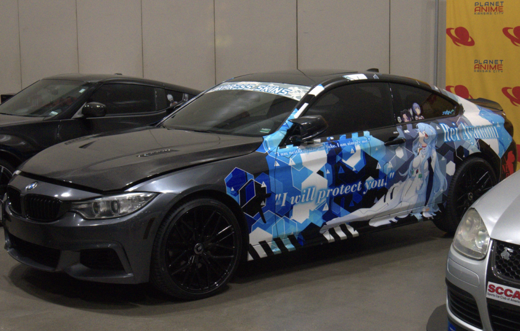 a car wrapped with a rei ayanami style livery.
