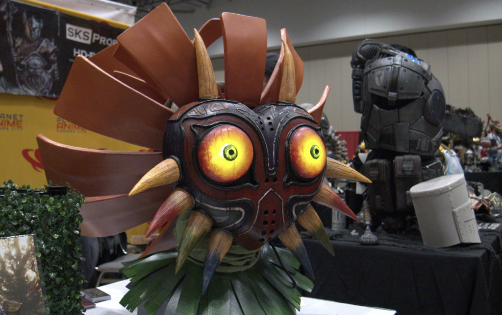 a highly detailed cosplay prop of majora's mask from the legend of zelda.